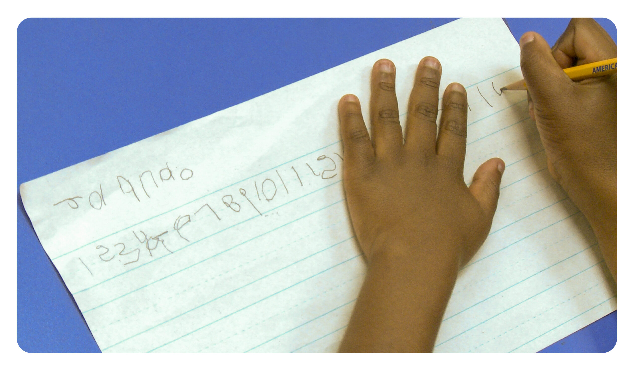 A piece of paper with a student writing on it.